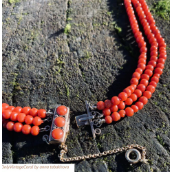Oxblood Antique coral bead in a 3 strand necklace with vintage 9k rose gold clasp toped with 3 matched coral cabochons